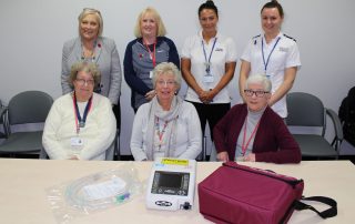 League of Friends Volunteers and Respiratory Physiotherapy Team with cough assistor