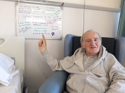 Patient Derrick with What Matters To Me board