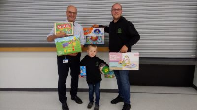 Handing over a bumper haul of toys for young patients