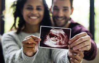 Happy couple with pregnancy news