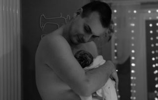 Dad Stephen with new baby daughter